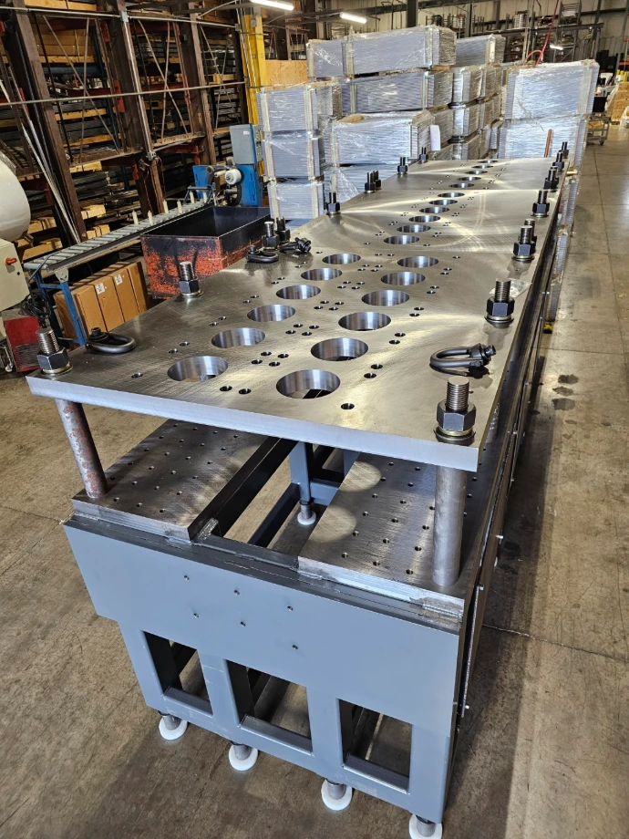 Custom-built industrial machine with a fabricated metal frame and work surface