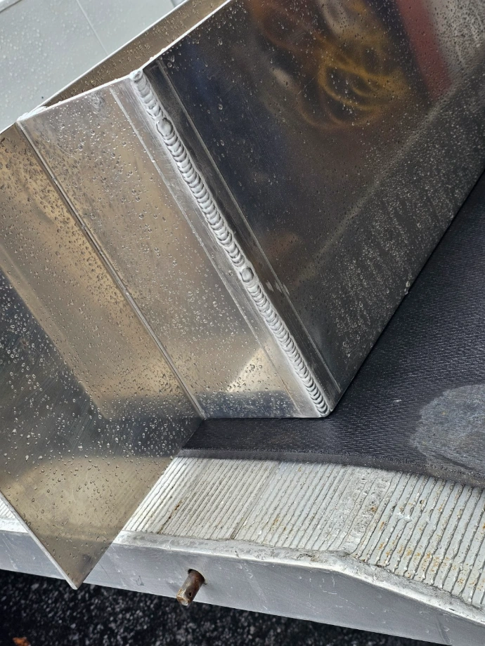 Close-up of a welded metal corner joint