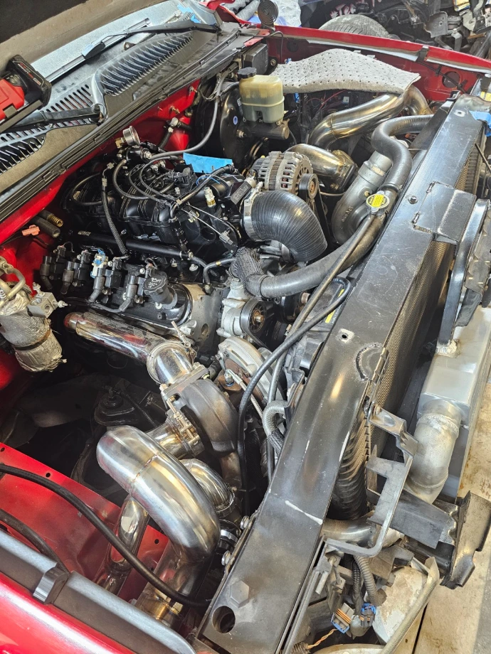 Performance engine bay with custom piping and fabricated components
