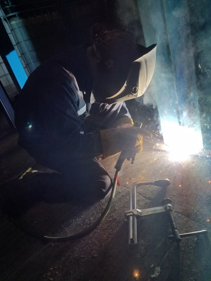 Stick welding a metal component during repair work