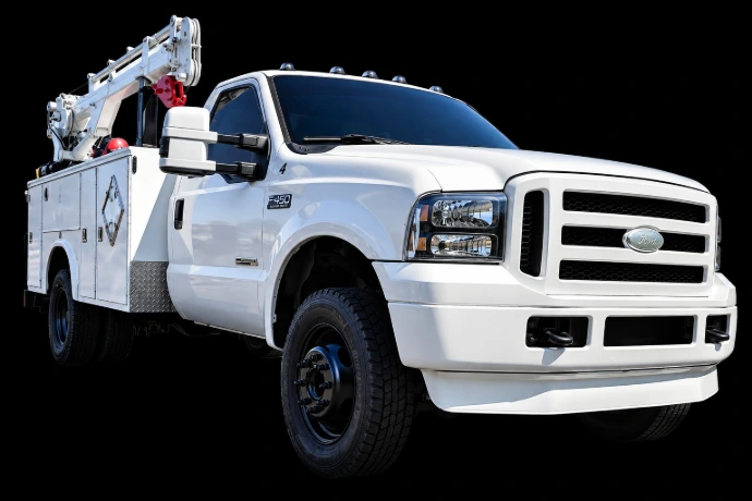 White Ford F-450 service truck equipped for mobile welding and machinery repair