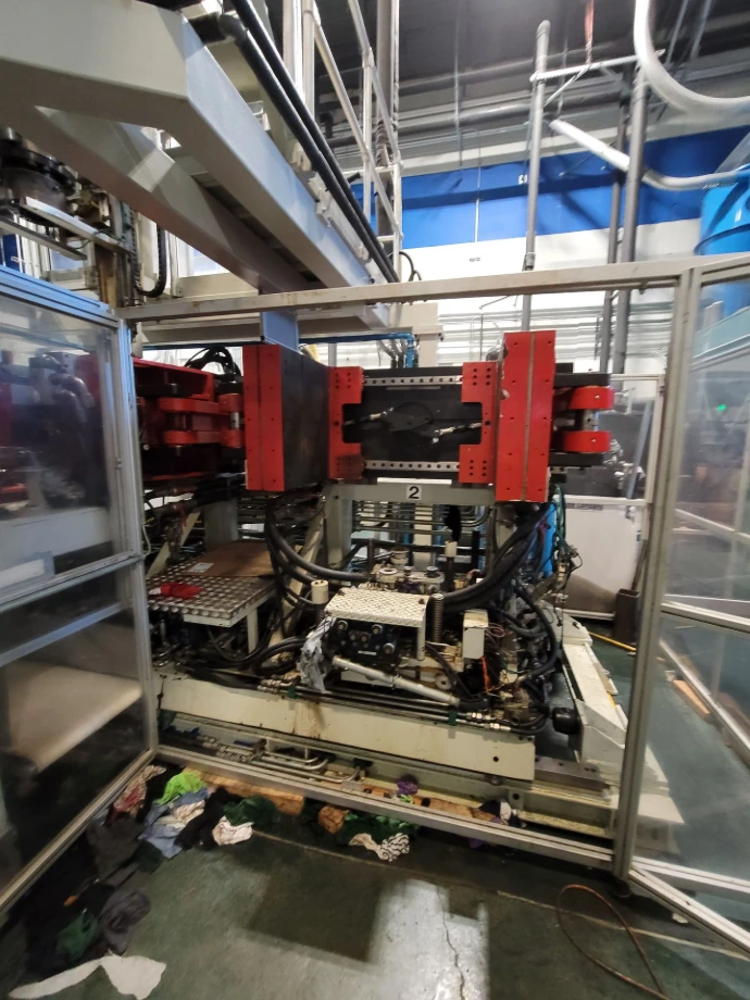 Front view of an industrial blow molding machine