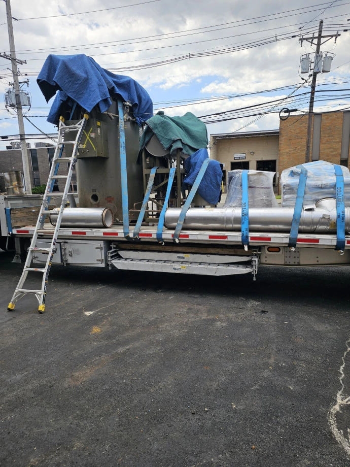 Removed Fulton boiler and associated equipment loaded for transport
