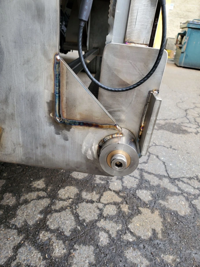 Side view of a welded metal bracket assembly